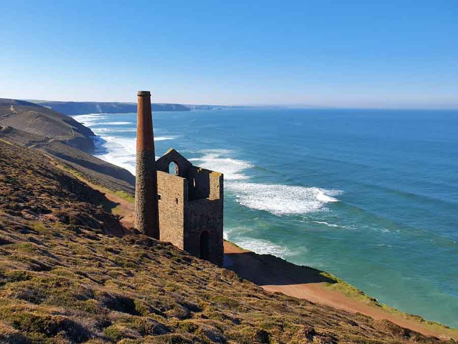 View of one of the iconic Cornish engine houses on the coastal path to Chapel Porth. One of many beautiful walks from the St Agnes Hotel Cornwall.